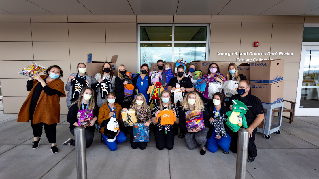 joyce university staff and faculty donating halloween costumes to primary children's hospital