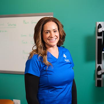 Female nursing student in blue Joyce University scrubs