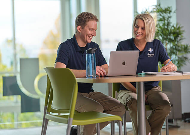 Joyce University ota students studying at table in student study center