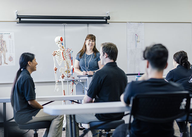 Joyce University faculty teaching OTA students in classroom