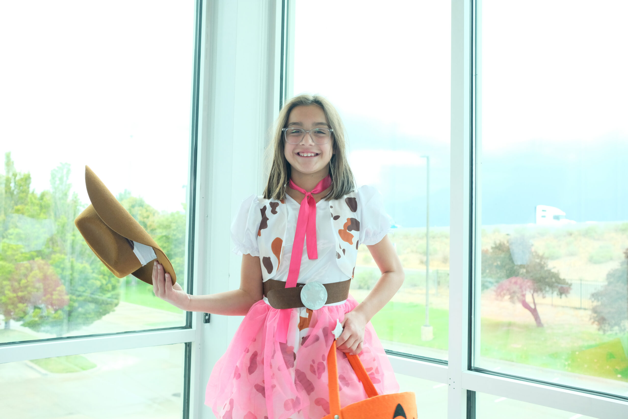 girl in cowgirl halloween costume