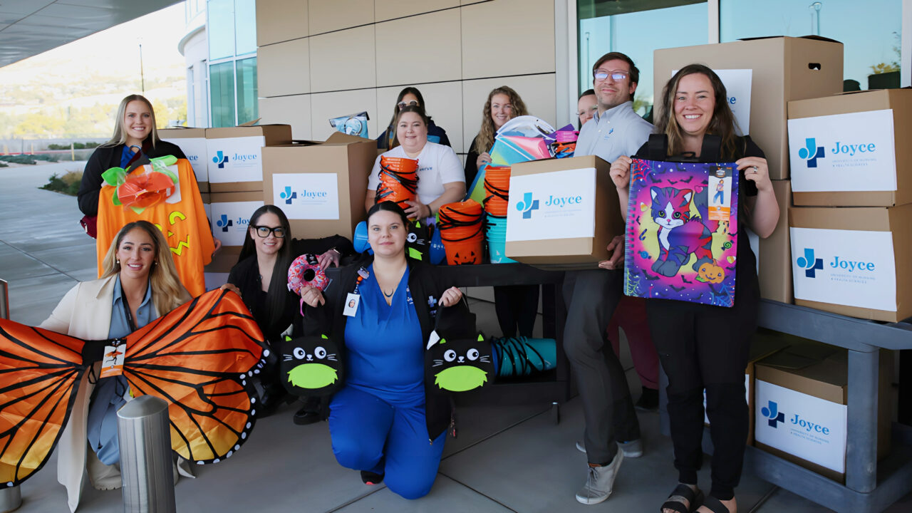 joyce staff delivering halloween donations to Primary Childrens Hospital