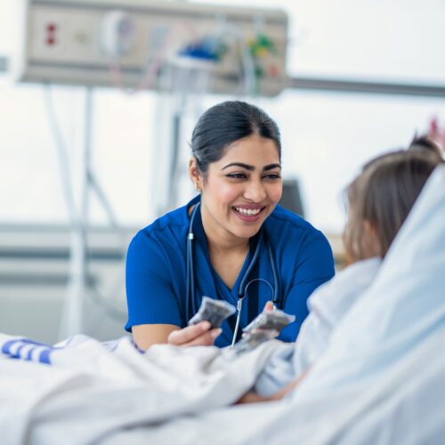 Joyce University nursing student with pediatric patient during direct-care clinical shift