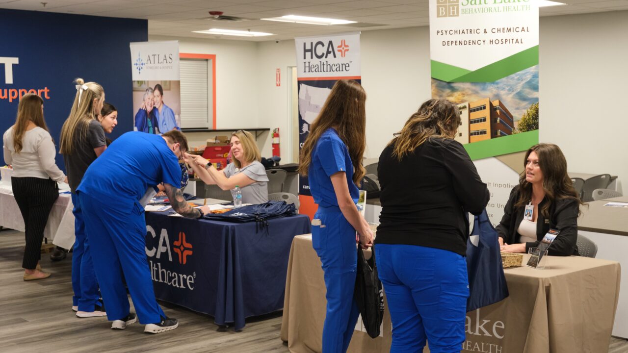 Joyce university students networking with future employers at the campus Career Fair