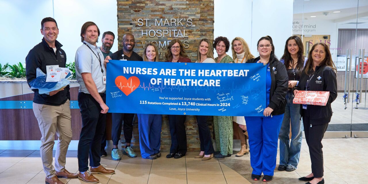 joyce university faculty with staff at st. marks hospital celebrating nurses day 2025 with a banner that says - nurses are the heartbeat of healthcare