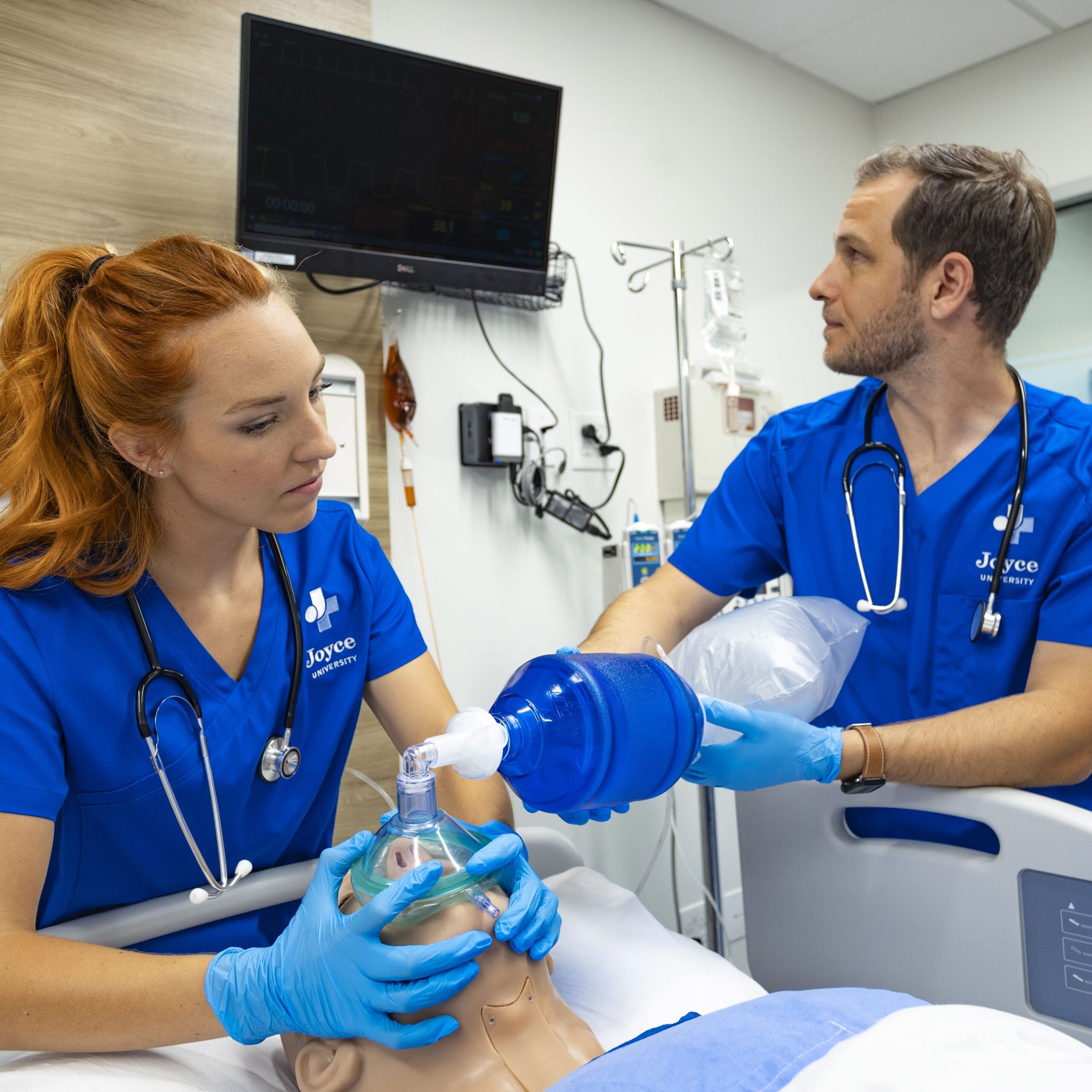 Joyce nursing students practicing on high fidelity patient simulator