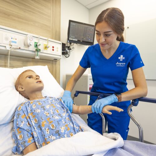 joyce nursing student learning on pediatric patient simulator