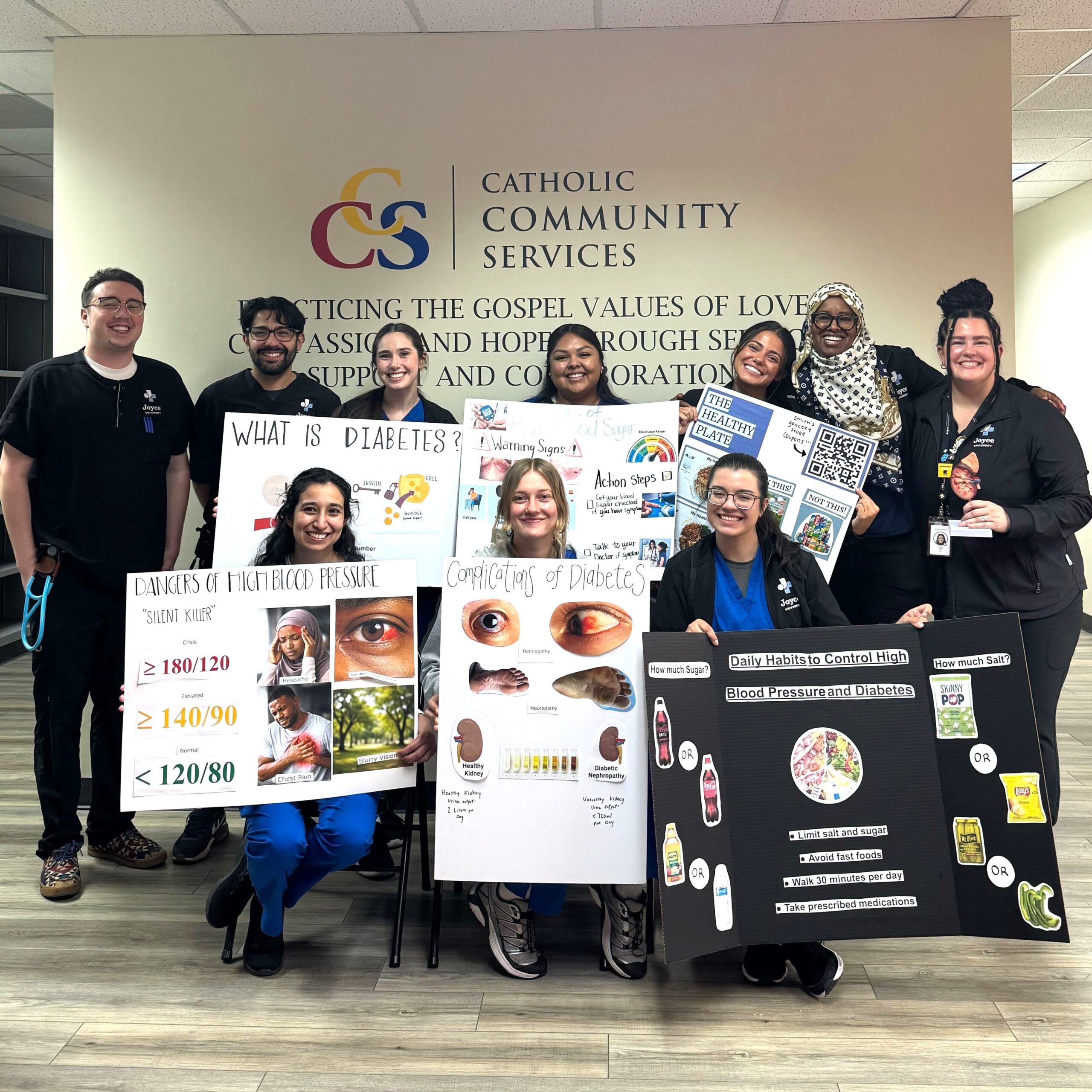 Joyce students holding posters at community health fair in utah