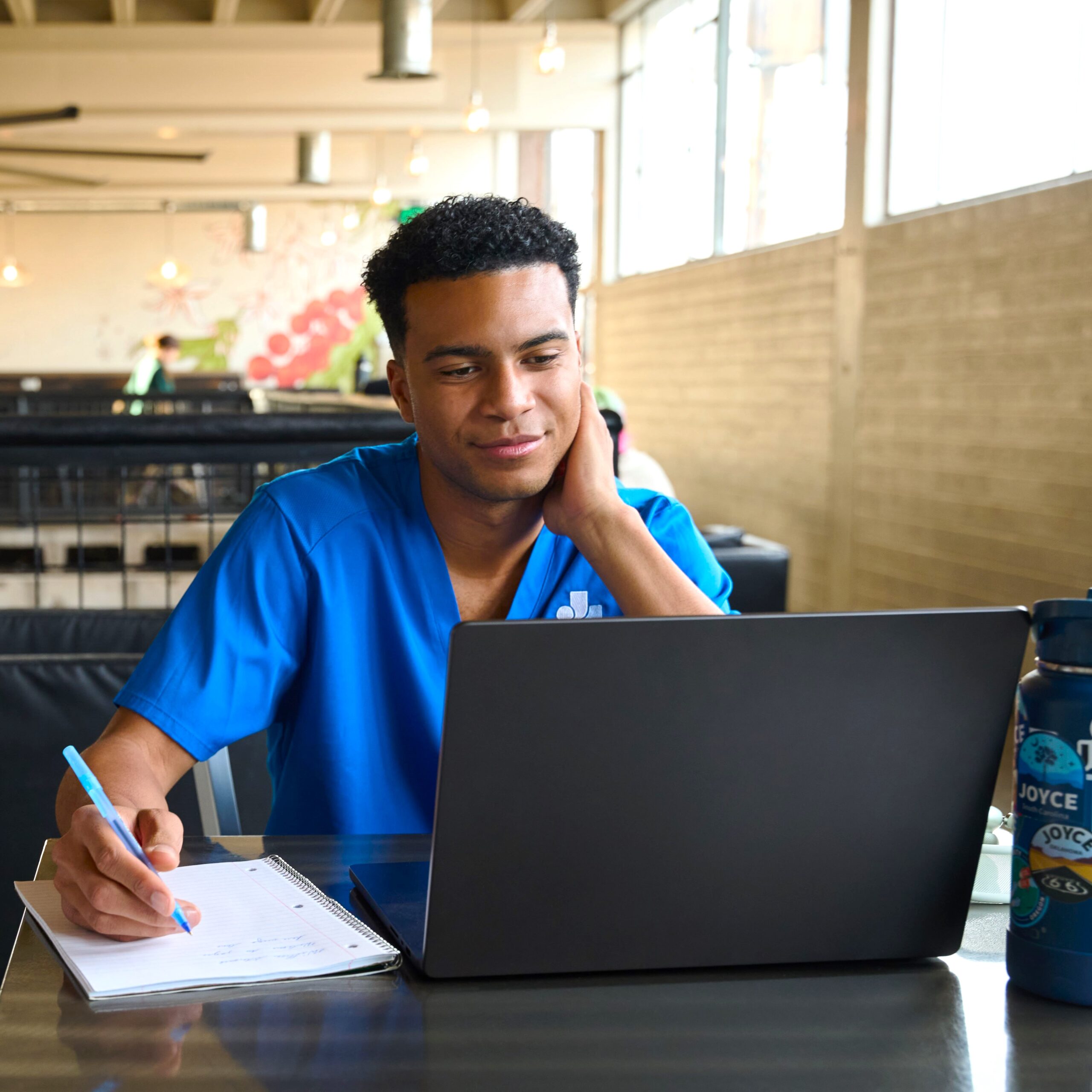 joyce student remote learning from a coffee shop