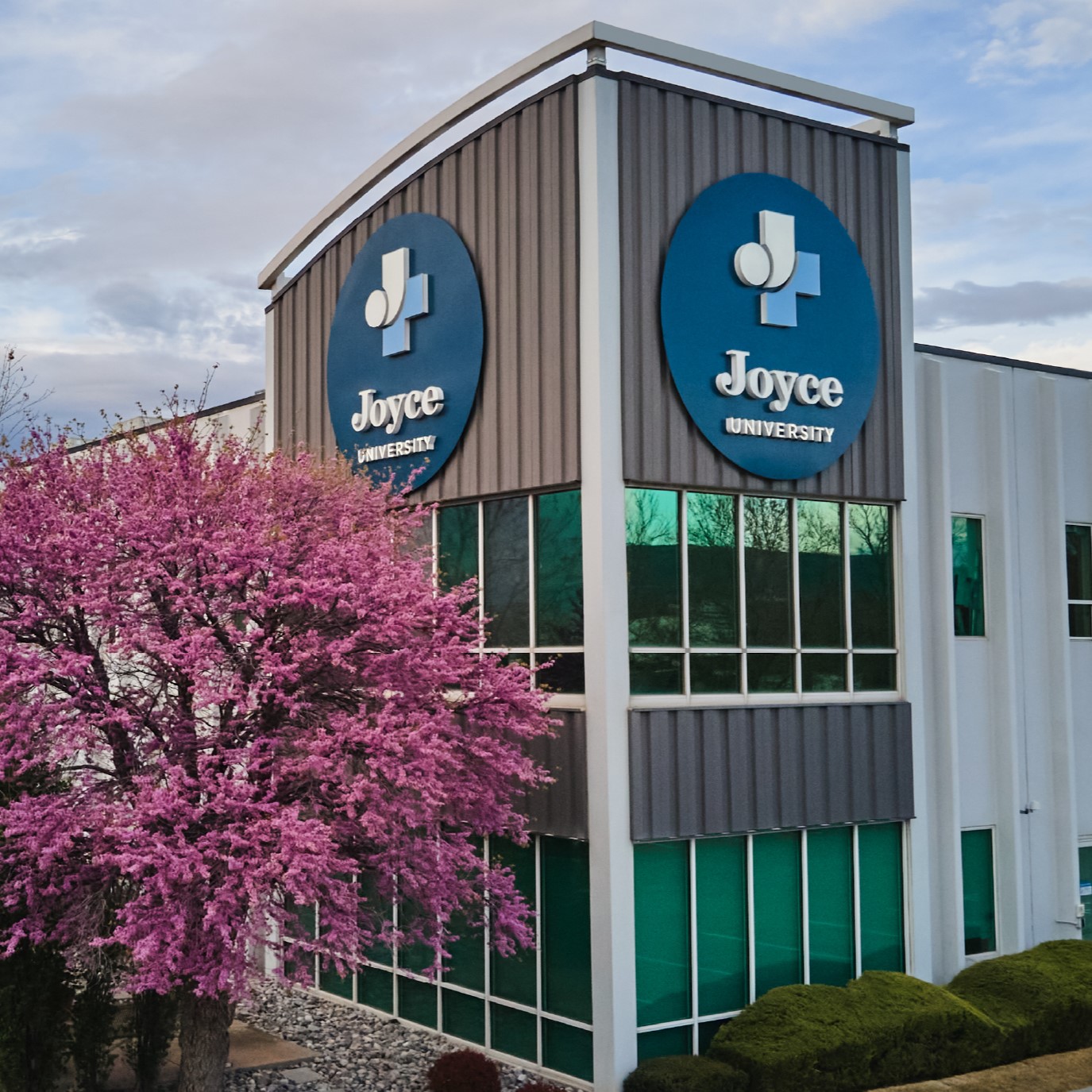 Joyce University Campus Exterior with Blooming Trees