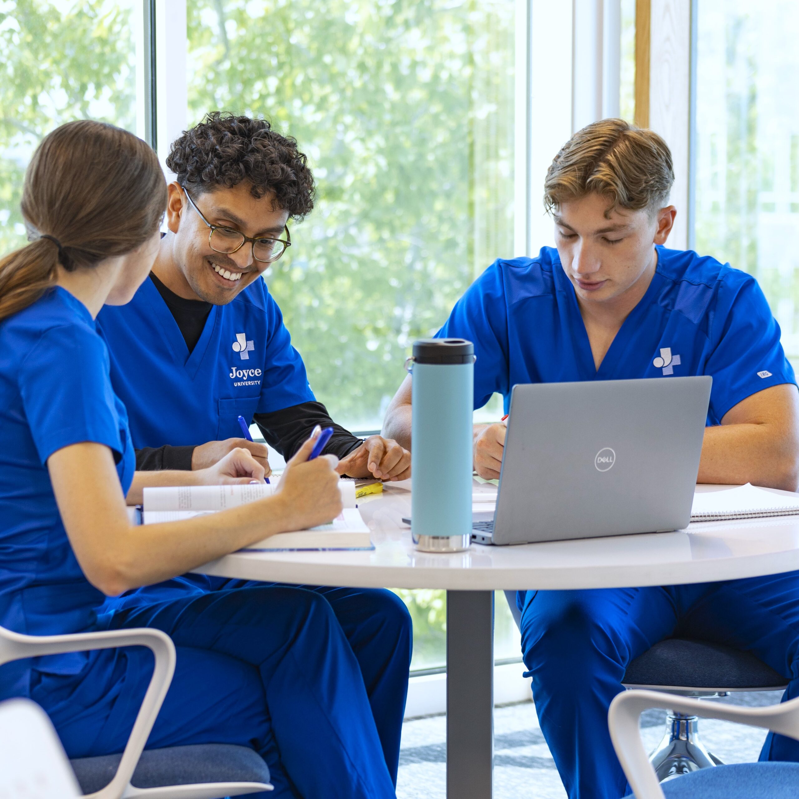 Joyce University students studying together on campus